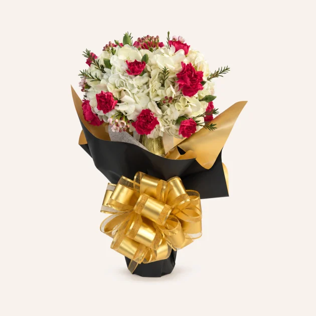 Celebration in Bloom floral cider gift with white flowers, deep pink carnations and a gold bow.
