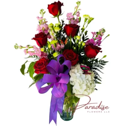 Beloved Bloom Bouquet featuring six red roses, peach stocks, white hydrangeas, green buttons, and lush greenery in a chic vase.