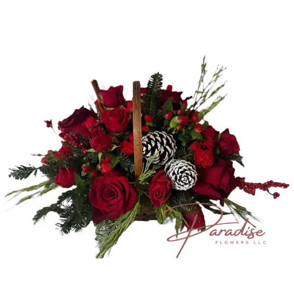 Berries and Spice Christmas arrangement featuring red roses, spray roses, carnations, hypericum, Christmas greens, and cinnamon sticks in a handled basket.