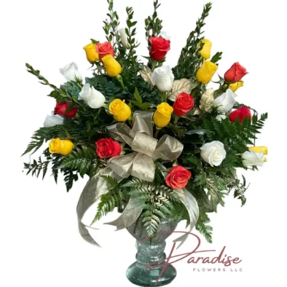 Three dozen mixed roses in a variety of colors, including red, white, and yellow, arranged in an elegant glass vase.