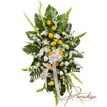 Golden Memories Standing Spray with white and yellow roses, snapdragons, mums, daisies, gladiolus, green carnations, white lilies, and lush greenery.