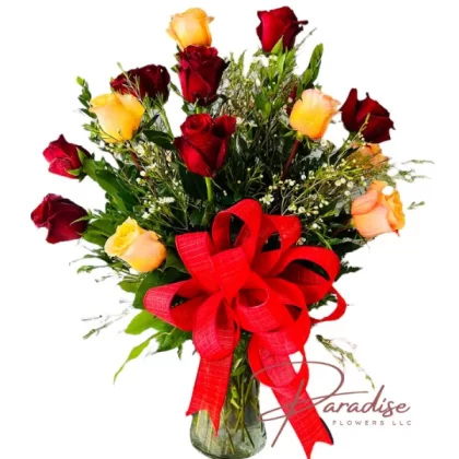 Pretty Love arrangement featuring 9 red roses, 9 peach roses, and lush greenery in a chic vase.