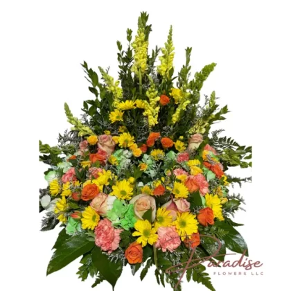 Radiant Farewell Tribute with yellow snapdragons, daisies, orange roses, spray roses, orange carnations, and green hydrangeas symbolizing cherished memories.