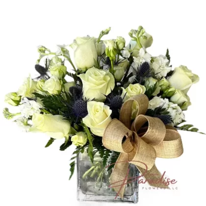 White Wings of Hope floral arrangement featuring white stocks, roses, hydrangeas, and lush greenery.