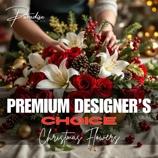 Luxurious Premium Designer's Choice Christmas arrangement with seasonal blooms and elegant holiday accents for grand celebrations or gifting.