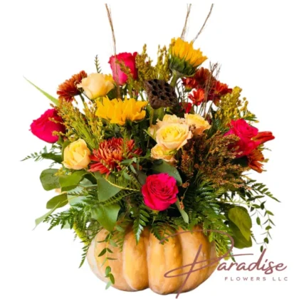 Premium Autumn Harvest Pumpkin Centerpiece with abundant hot pink roses, sunflowers, and lush foliage in a large natural pumpkin.