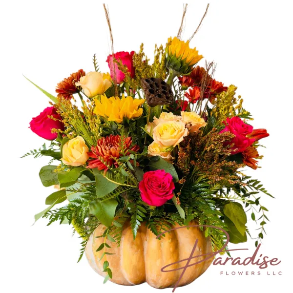 Premium Autumn Harvest Pumpkin Centerpiece with abundant hot pink roses, sunflowers, and lush foliage in a large natural pumpkin.