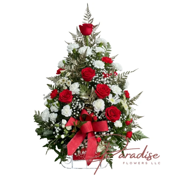 Sleigh Ride Christmas Tree Bouquet featuring red roses, white carnations, and baby's breath arranged in a decorative sleigh base.