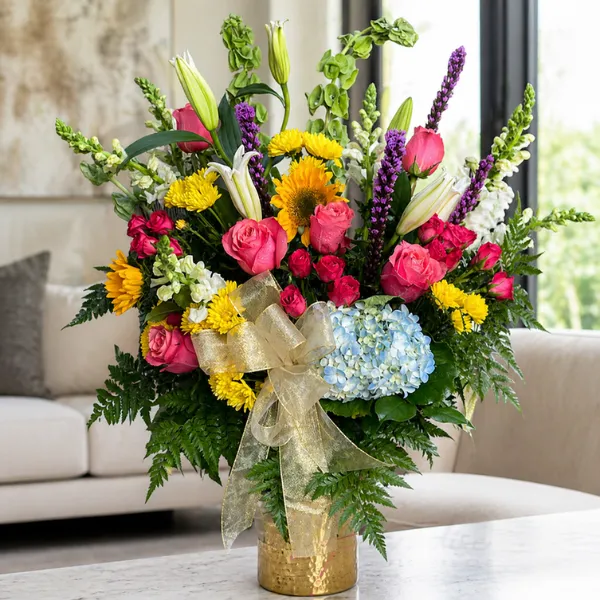 Massive Blooming Affection Arrangement dominating a bright living area space.