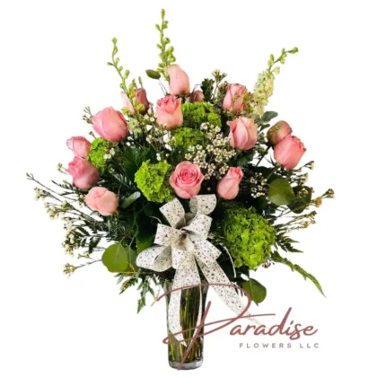 Pink Devotion – Mother's Day pink rose arrangement with premium pink roses, green hydrangeas and white ribbon in a clear glass vase